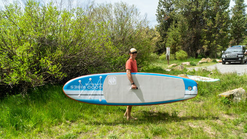 Holding stand on liquid good vibes inflatable stand up paddleboard