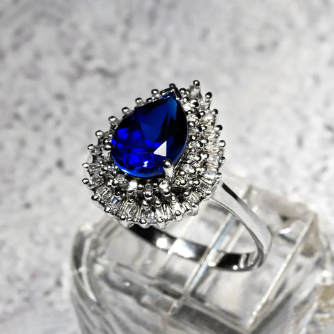 Celestial Beauty Captured: Behold the White Gold Blue Birthstone Ring, a Radiant Symphony of Elegance and Personalized Charm, Celebrating Your Unique Story with Every Glint.
