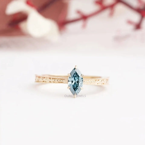 Blue marquise cut lab diamond promise ring in rose gold and claw prong settings.