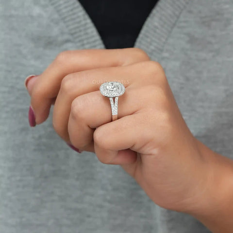 Wonderful and stylihsh fashionable white gold engagement ring for women adorned with a brilliant round diamond cluster, embraced by a prong setting and enhanced by a halo.