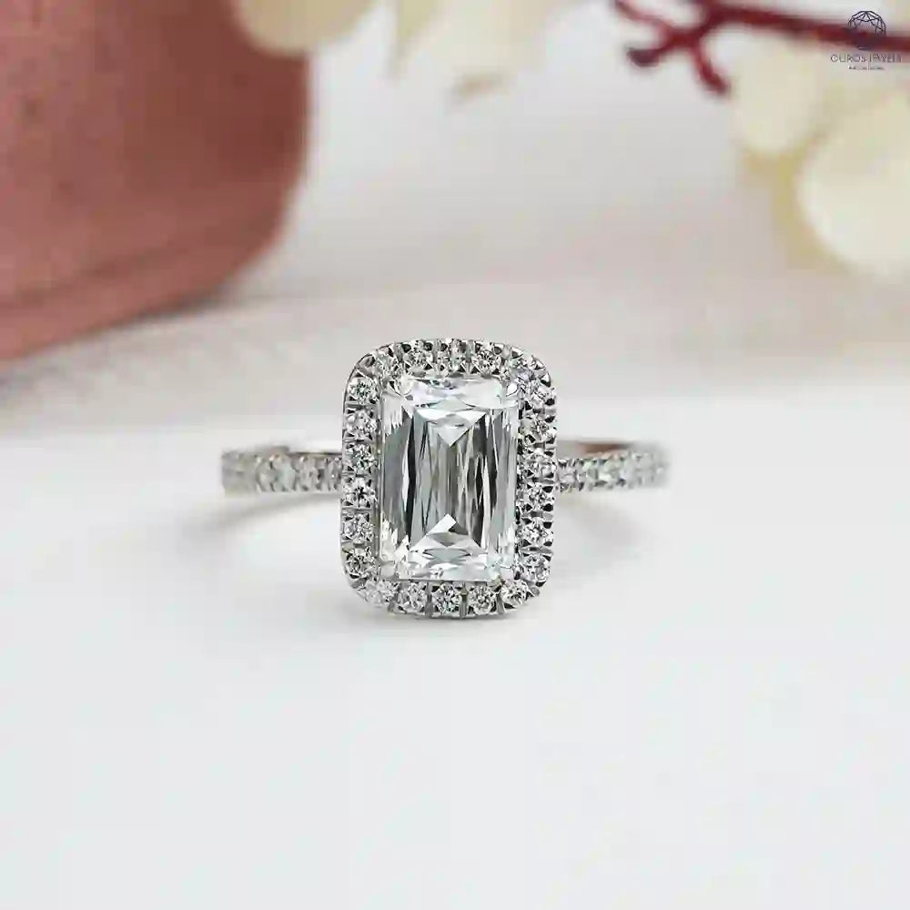 Brilliant modified emerald cut diamond engagement ring for her in white gold and round prongs content