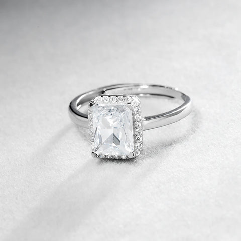 Elegant emerald-cut diamond set in a white gold ring, showcasing a timeless and sophisticated piece of fine jewelry.