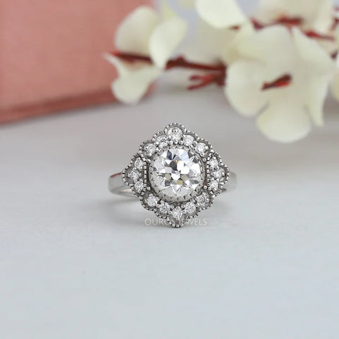Old European cut lab diamond Art deco engagement ring style containing a white gold and intricately detailed pattern.