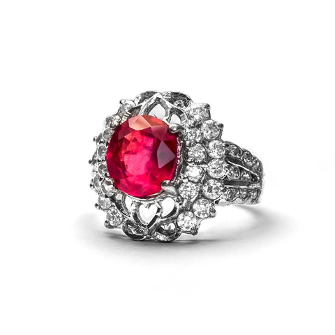 Pink oval birthstone flower style halo engagement ring with white gold that looks captivating and dazzling on the finger.