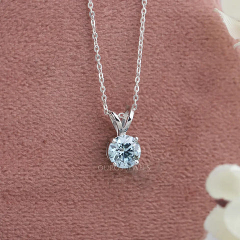 Elegant greenish-blue round diamond solitaire necklace pendant for women, a stunning accessory that adds sophistication to any ensemble.