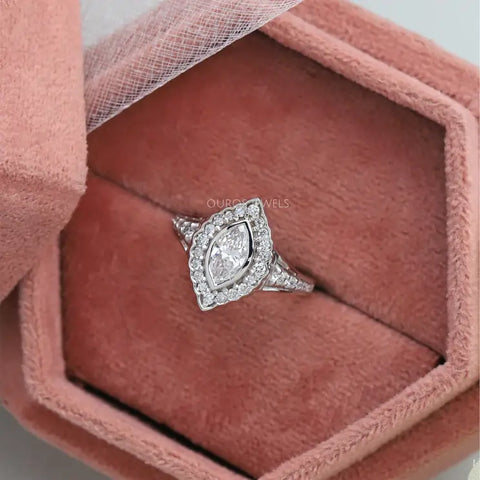 Marquise diamond Art Deco vintage engagement ring with a royal white gold look and fancy patterns perfect for the wedding proposal.