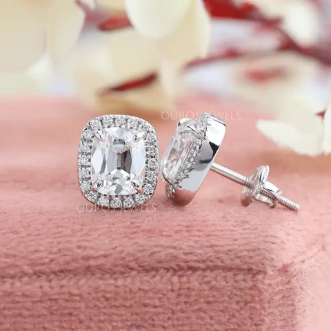 Old mine cushion diamond stud earrings in white gold with the prong settings and proper fitting arrangements for screw back types in ear back types.