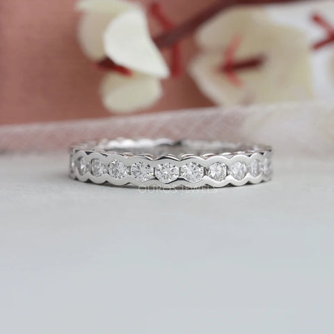 White gold bezel channel set wedding eternity band made with brilliant cut round lab-grown diamond.