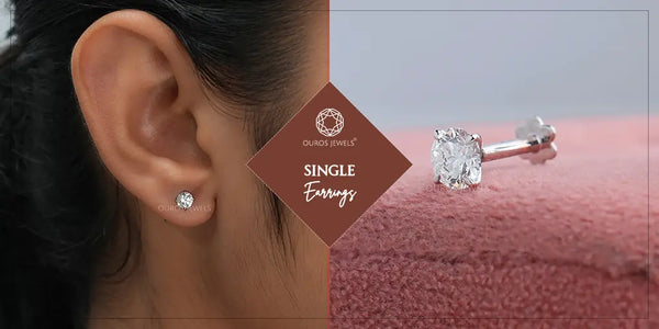 [Close-up of a woman's ear wearing a single diamond stud earring, with a single diamond stud earring displayed on a pink surface]-[ouros jewels]