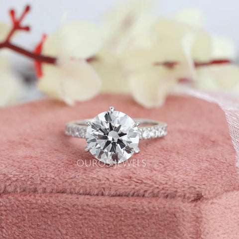 Round diamond solitaire accent ring in white gold