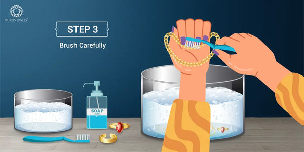 [Step 3: Brush Carefully - Illustration of a person gently brushing jewelry with a toothbrush over soapy water, with cleaning tools and other jewelry nearby.]-[ouros jewels]