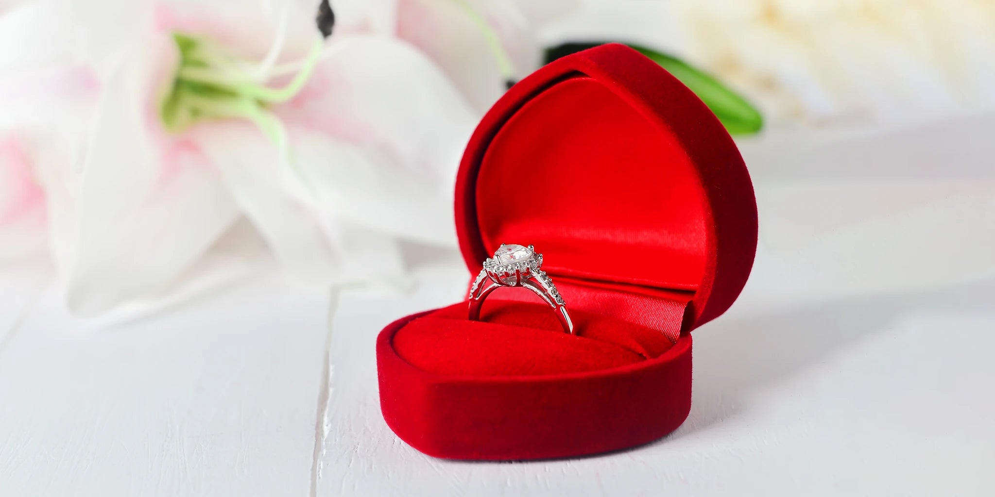 Precious diamond engagement white gold ring for women in red jewelry box to be gifted as a love sign for tie-up a relationship.