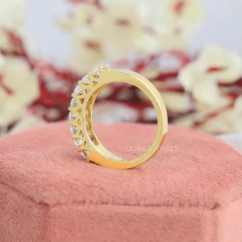Yellow gold fancy oval lab diamond wedding ring for women having a surface shared prong settings that makes a ring modern choice for commitment.