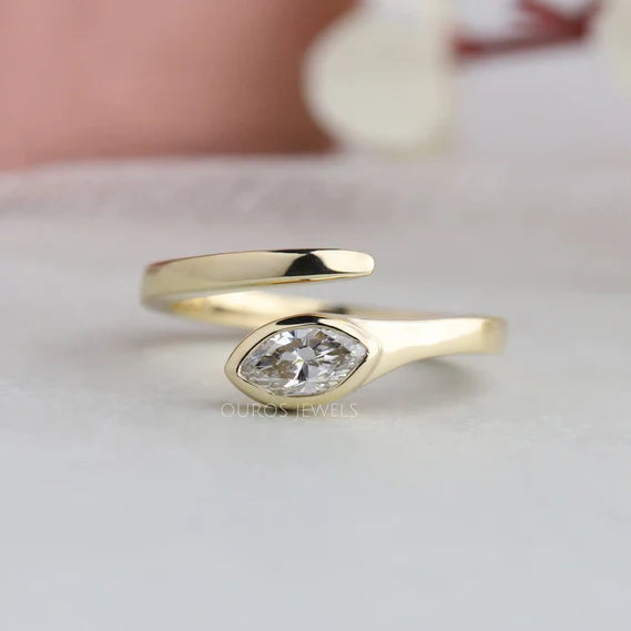 [Shop Lab Grown Diamond in this 14K Yellow Gold Bezel Set Marquise Engagement Ring designed for women. Features a unique bypass solitaire ring, Click to view!]-[ouros jewels]