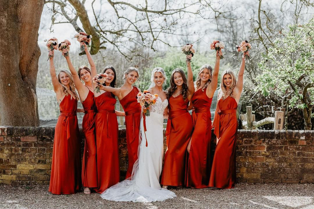 Burnt orange one shoulder and slip style bridesmaids dresses