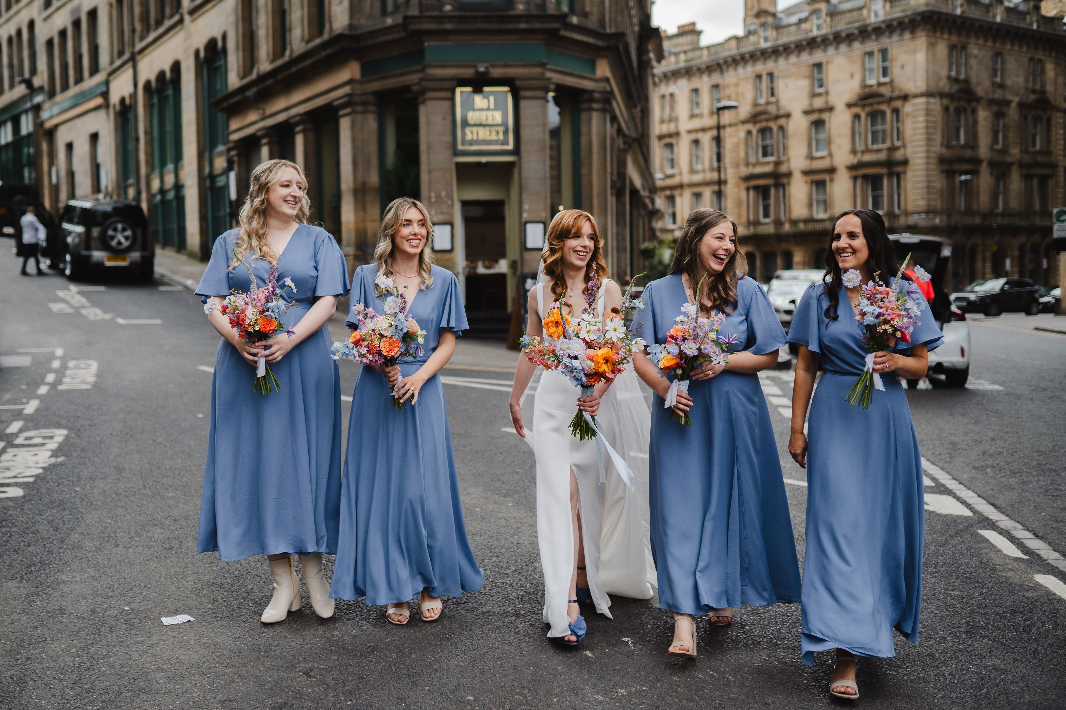 Soft pale cornflower blue wrap bridesmaids dresses