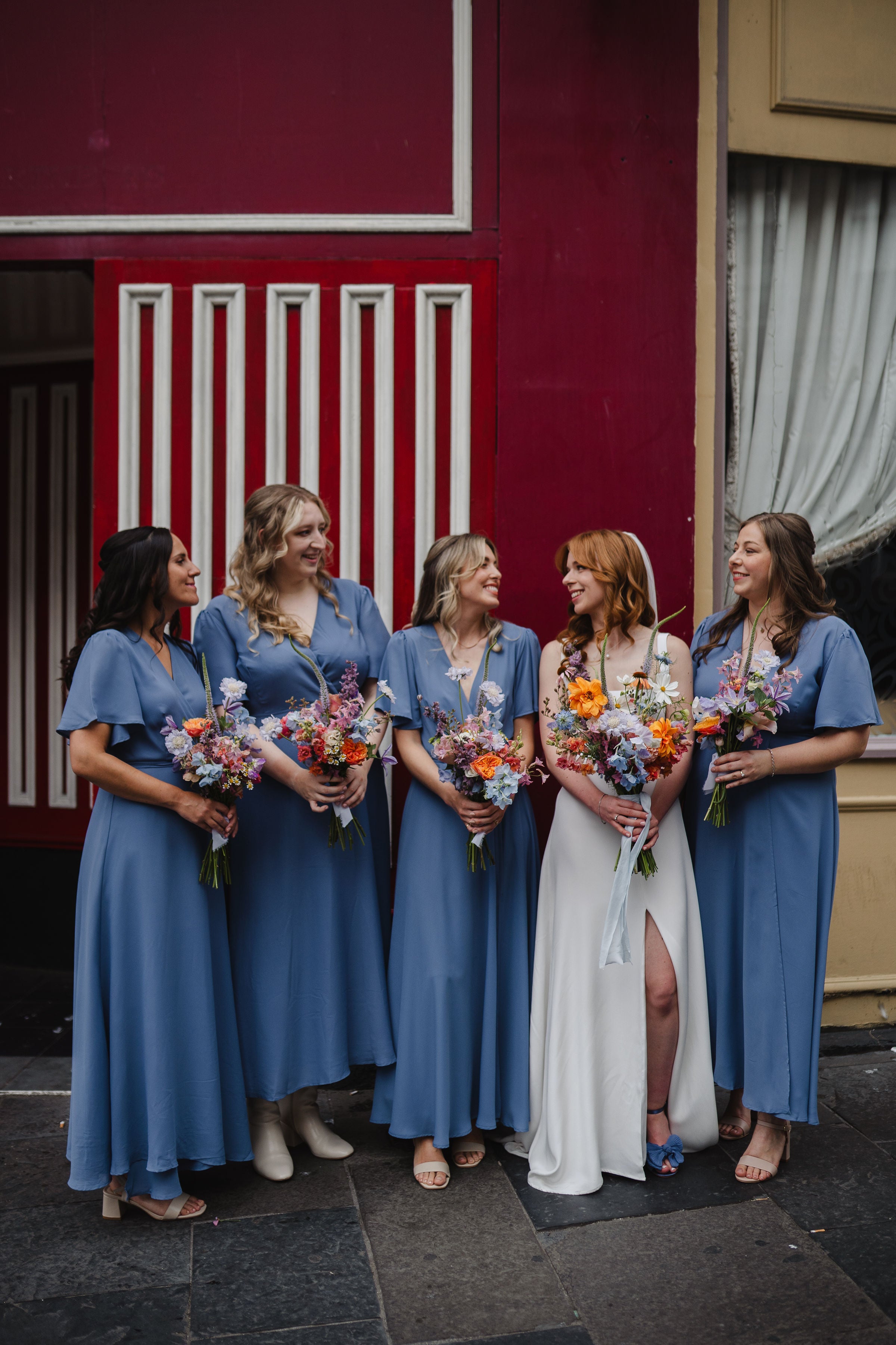 Soft pale cornflower bluebell blue wrap bridesmaids dresses