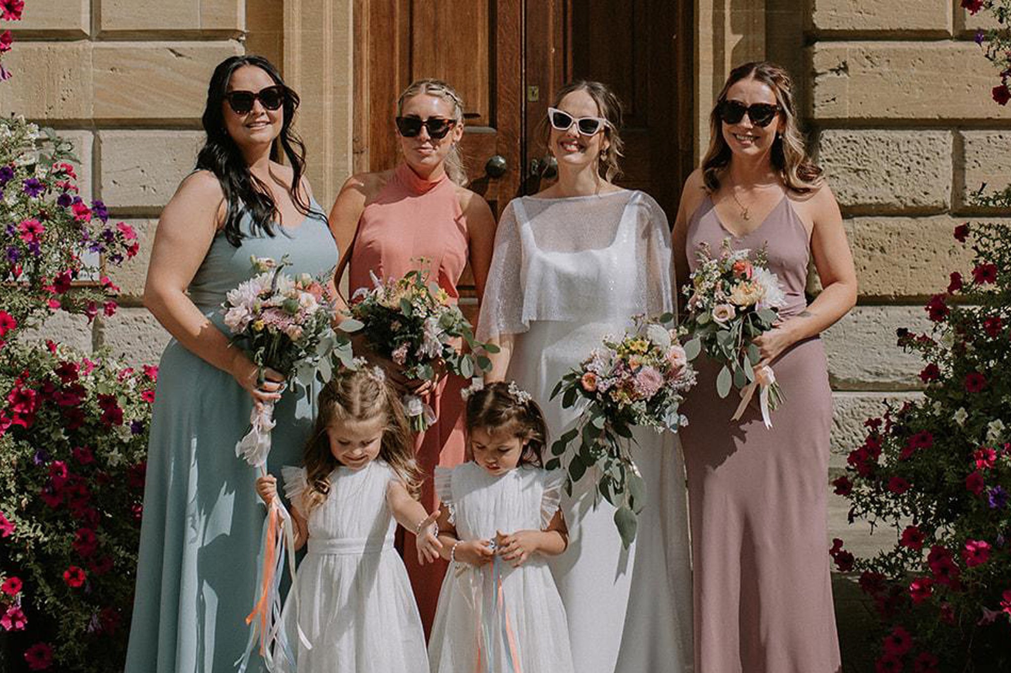 Bride, bridesmaids and flower girls