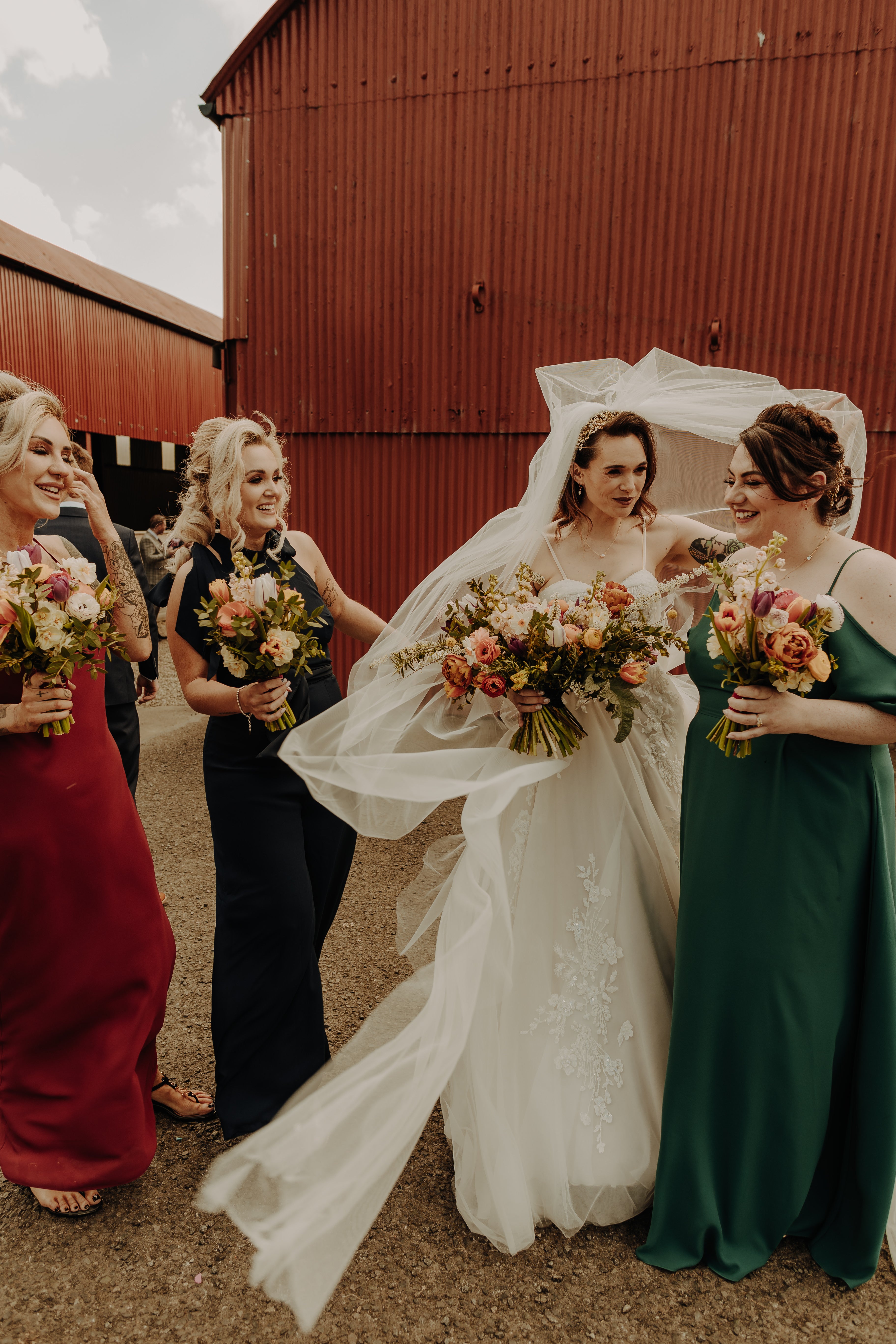 Bold colour mix and match bridesmaids dresses