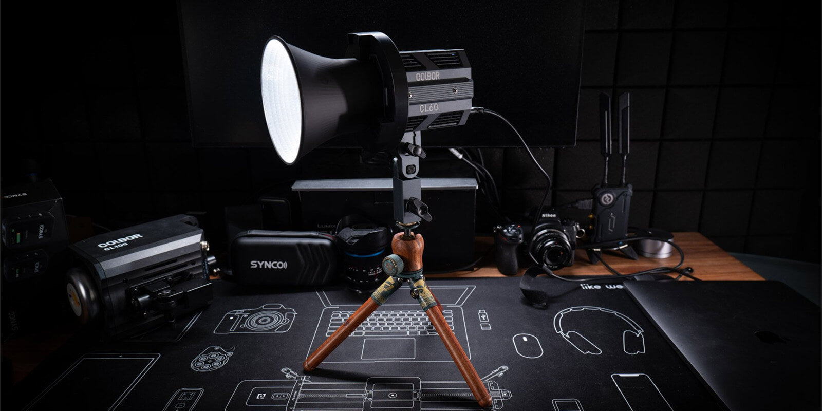 COLBOR CL60 best studio light for video is mounted on a light stand and placed on the table.