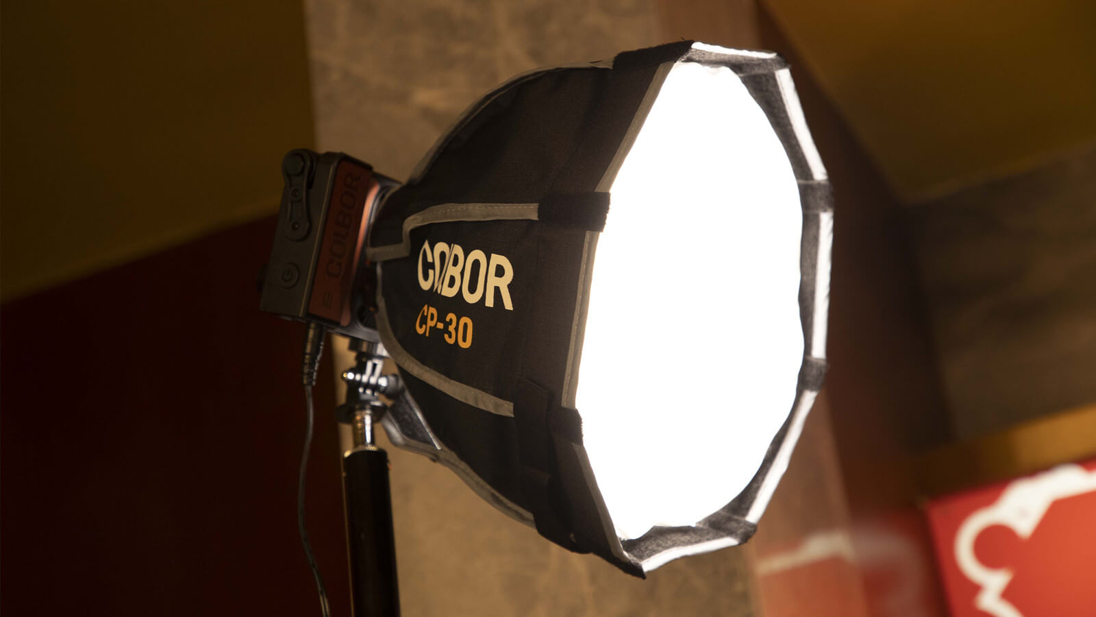 COLBOR W100 portable video light can be used with a softbox to create soft lighting for video calls