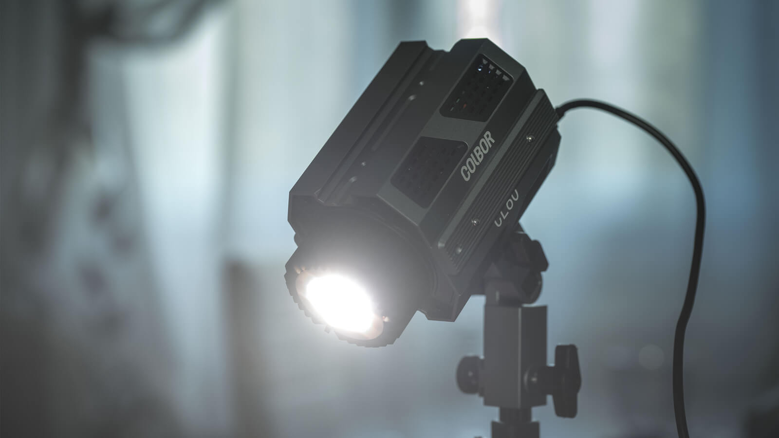 COLBOR CL60 best studio light for video is mounted on the light stand and shines down to illuminate the scene.