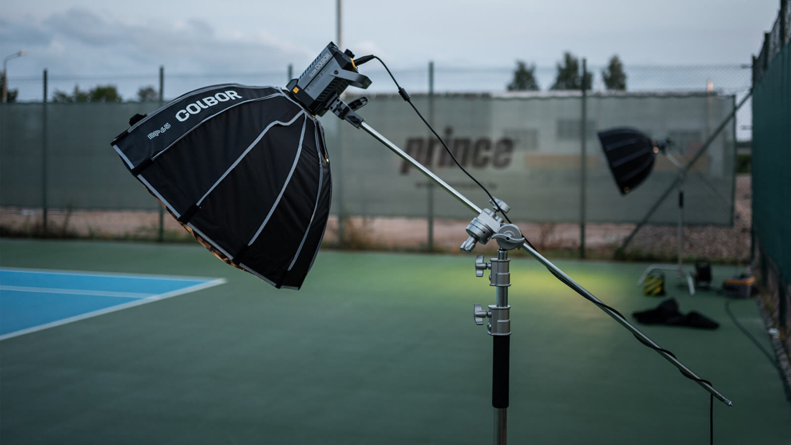 The COLBOR CL220 LED constant light is used with a softbox to illuminate the outdoor scene.