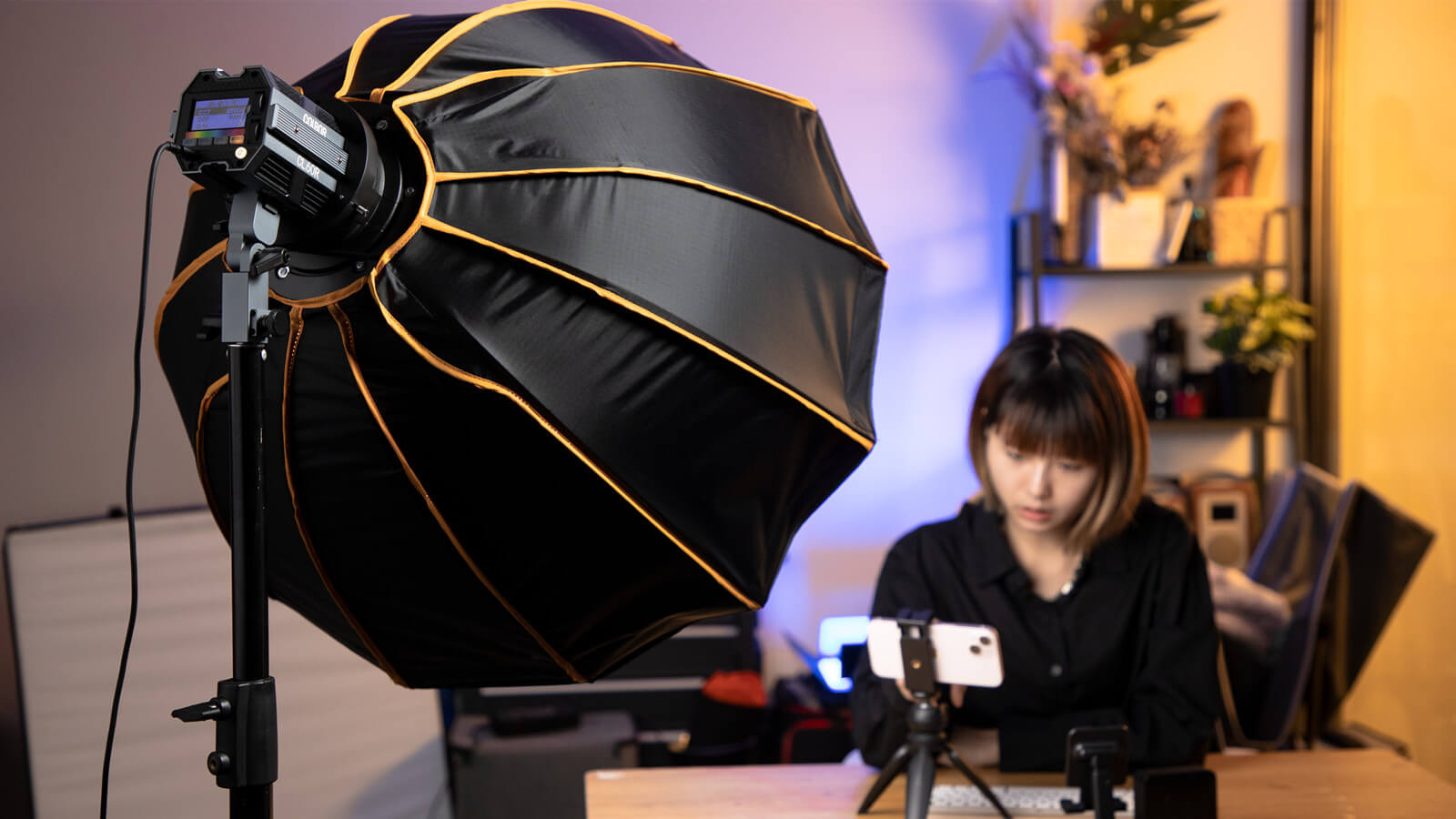 COLBOR CL60R RGB LED light is used with a softbox to offer soft lighting for video recording.