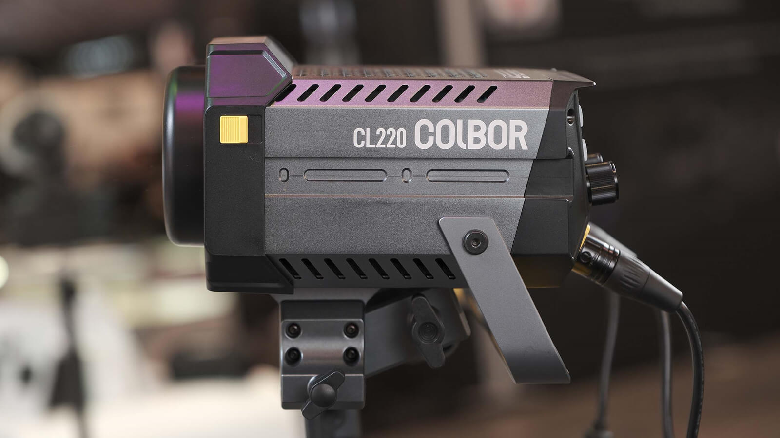 COLBOR CL220 LED light for portrait photography is connected with a power cord.