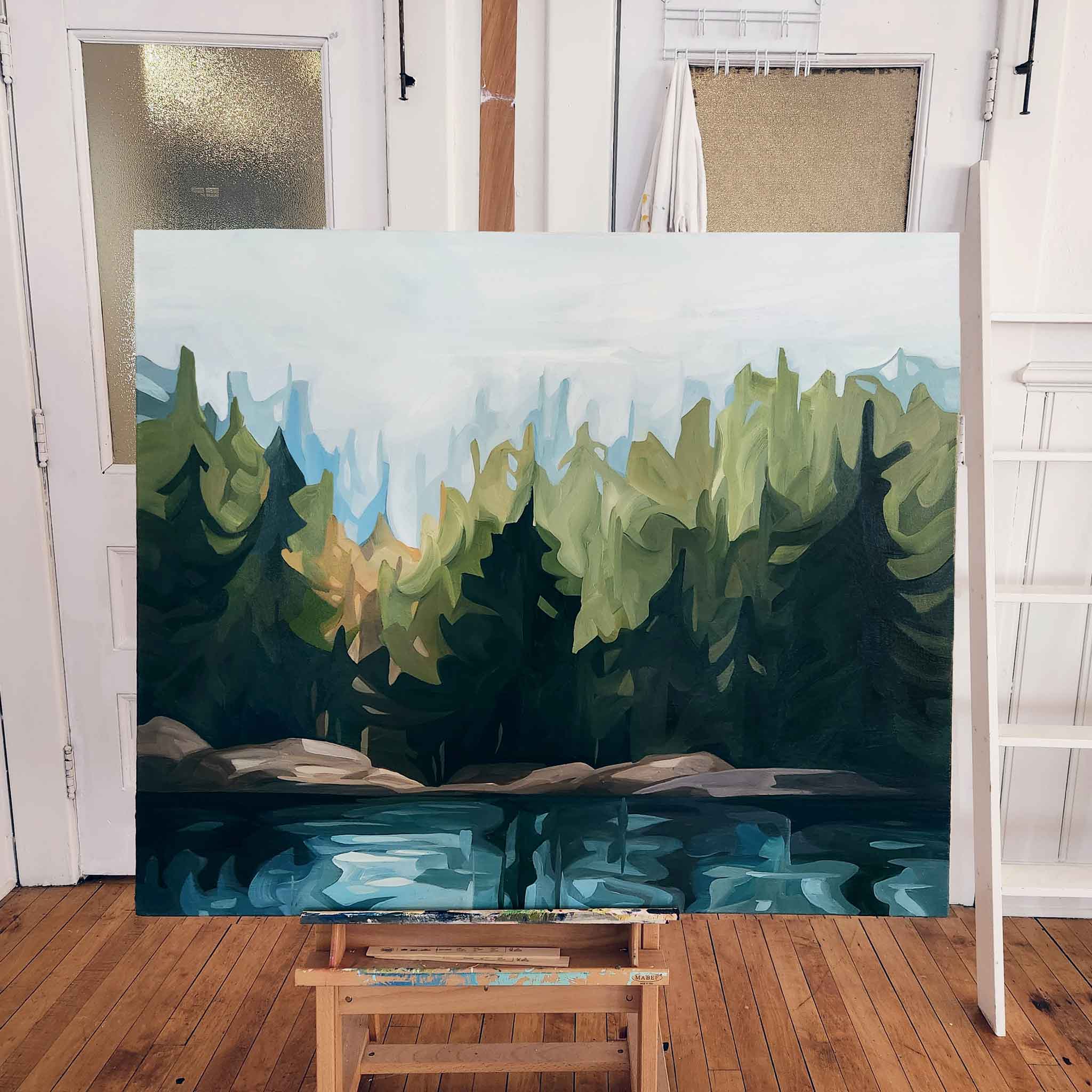 large original painting of forest landscape in studio