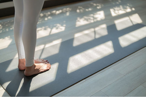 Woman's feet on mat