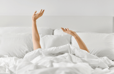 Woman hands in bed