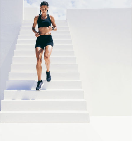 Woman running down the stairs