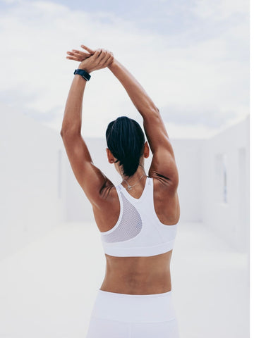 Woman stretching in sporty outfit