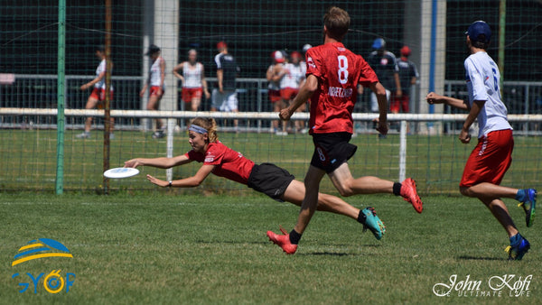 ultimate frisbee players catching a frisbee