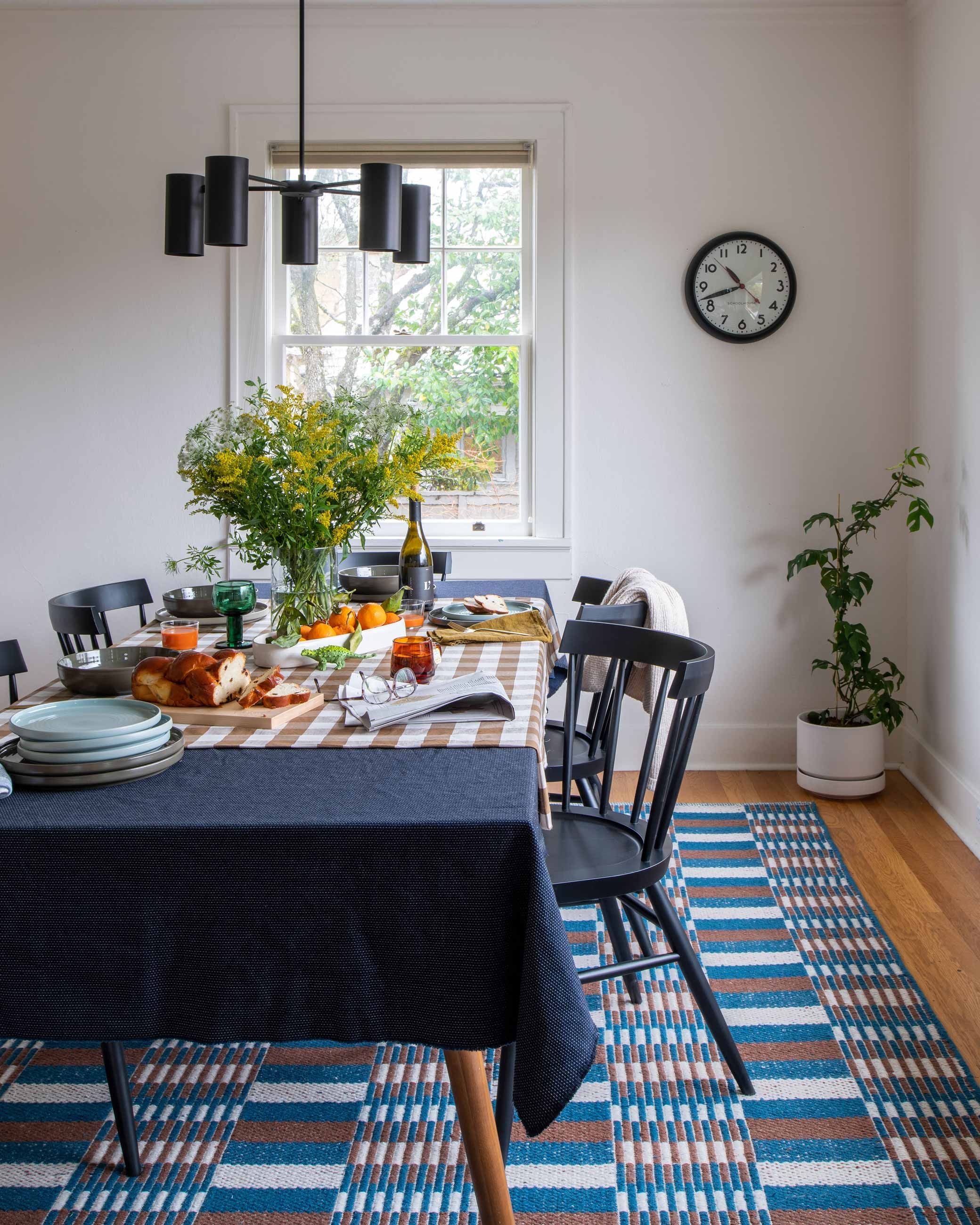 mid century modern dining room with black chandelier