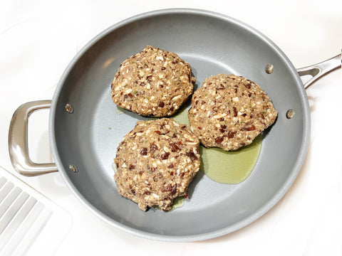 add patties to add sauce to  id21 stainless steel coated fry pan for earth day veggie burgers
