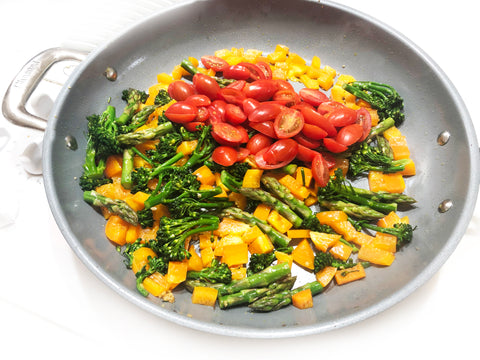 tomatoes peas bell pepper and broccoli frying in ID21 ceramic coated 12 1/2 inch fry pan