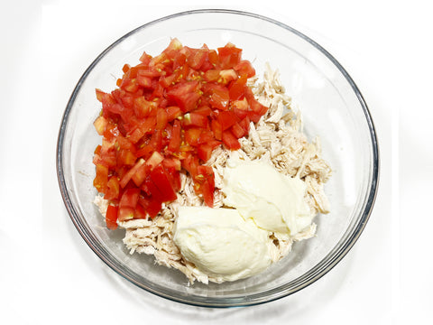 add in mayo and tomatoes to shredded chicken for cucumber rollups using induction 21 steel stockpot and strainer insert