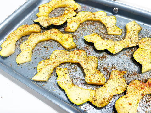 add paprika and oregano to slices on nonstick griddle