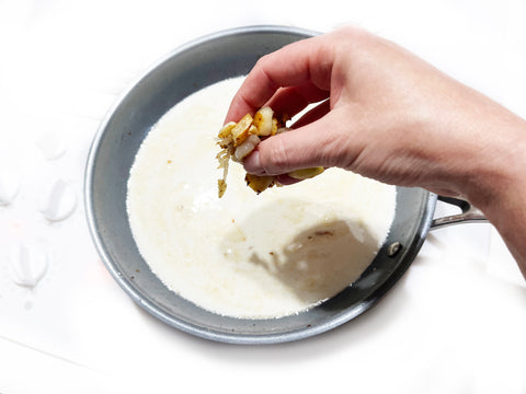 cream sauce and shallots in 10 inch fry pan