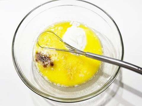 whisk together eggs in glass bowl for blueberry bread