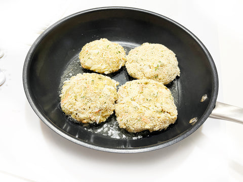adding crab cakes to 8 inch stripes fry pan