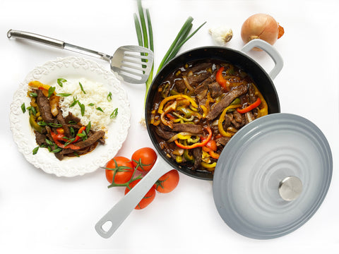 asian steak and peppers in grey cast iron 4 quart skillet