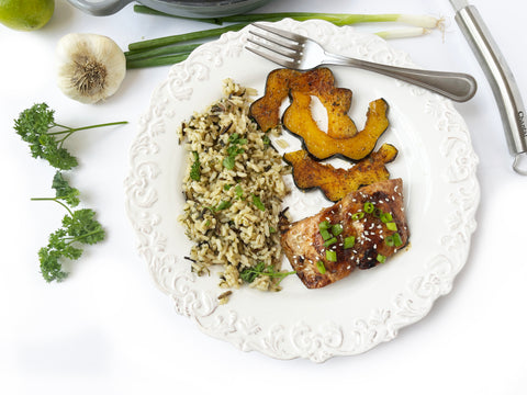salmon and rice served with roasted acorn squash