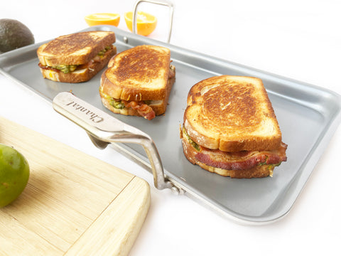 3 breakfast sandwiches on nonstick griddle