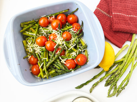 asparagus and tomatoes in glacier blue square oven dish served with crab cakes