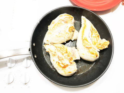 Kitchengear fry pan with cooked chicken breasts