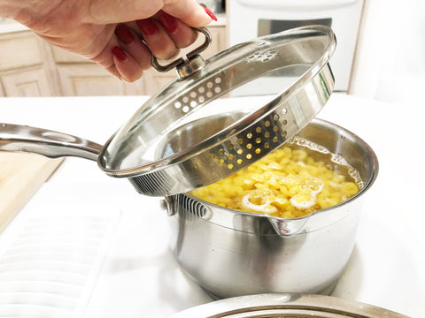 using strainer lid on induction 21 steel saucepan to drain water off of pasta