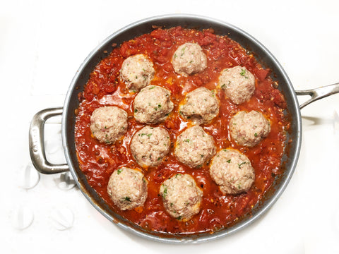 adding meatballs to marinara sauce in 12.5 inch coated induction 21 frypan for chicken parmesan